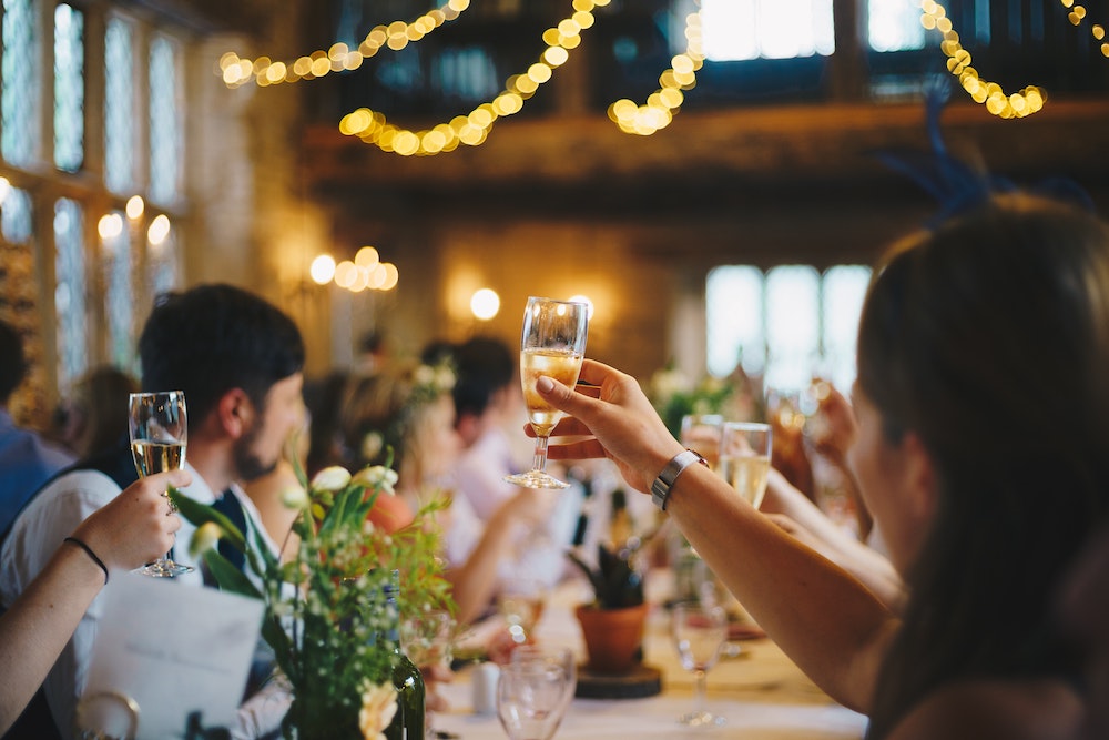 raised glass wine wedding