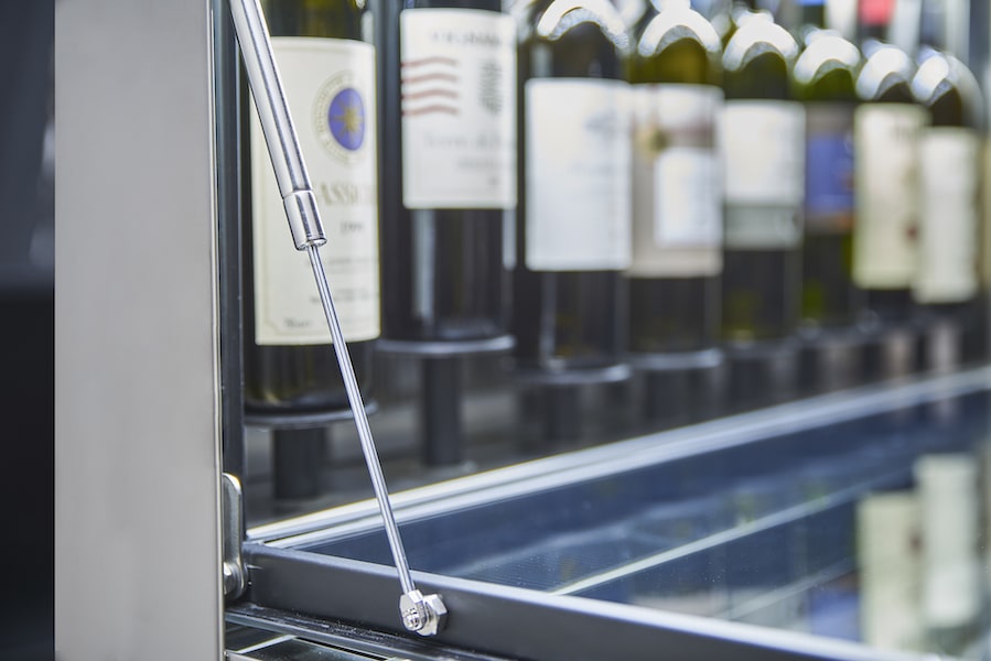 Unica wine dispenser door details with gas struts opening